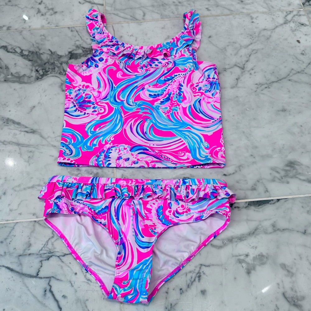 Adorable 2 piece swimsuit. No damage and only worn once or twice.